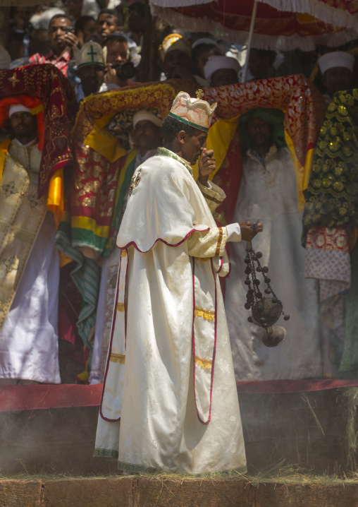 Ethiopian Orthodox Priest Spreadinf Insence During The Colorful Timkat Epiphany Festival, Lalibela, Ethiopia