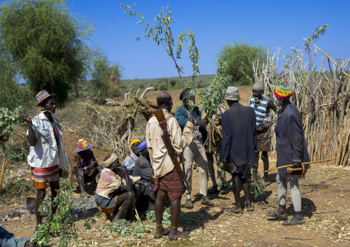 Men Negociating During A Mourning Ceremony To Know How Many Cows Will Be Killed In Hamer Tribe, Turmi, Omo Valley, Ethiopia