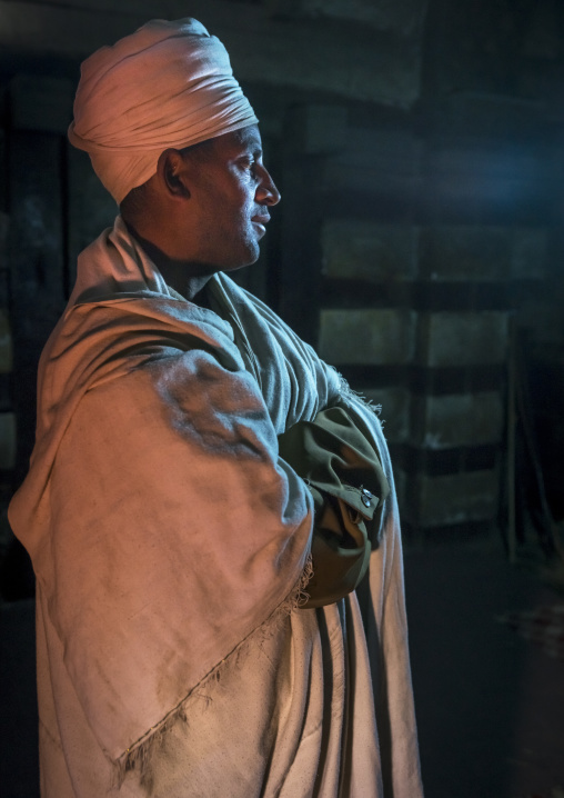 Priest Inside Yemrehana Krestos Rock Church, Lalibela, Ethiopia
