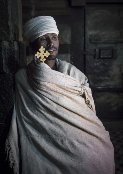 Reverend Taklu Melkamu Holding A Cross, Yemrehana Krestos Rock Church, Lalibela, Ethiopia