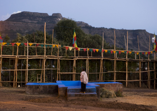Orthodox Pilgrim In Front Of The Pool At Timkat Festival, Lalibela, Ethiopia