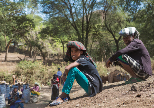 Oromo men protecting themselves from the sun in a market, Oromo, Sambate, Ethiopia