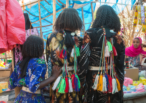 Rear view of oromo girls with pompoms to show they are singles, Oromo, Sambate, Ethiopia