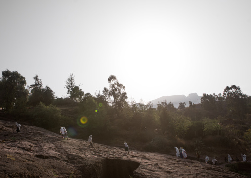 Ethiopian people walking along a hill, Amhara region, Lalibela, Ethiopia