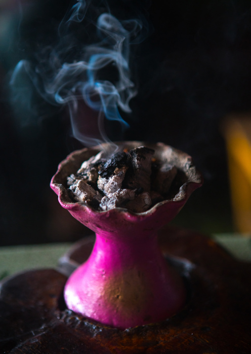 Ethiopian traditional coffee ceremony with incense burning on charcoal, Semien wollo zone, Woldia, Ethiopia