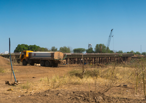 Metal bridge being built by chinese workers above omo river, Omo valley, Kangate, Ethiopia
