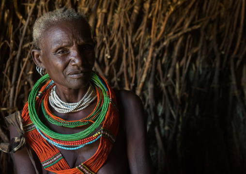Toposa tribe woman in her hut, Omo valley, Kangate, Ethiopia