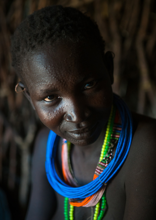 Toposa tribe woman with scarified face, Omo valley, Kangate, Ethiopia