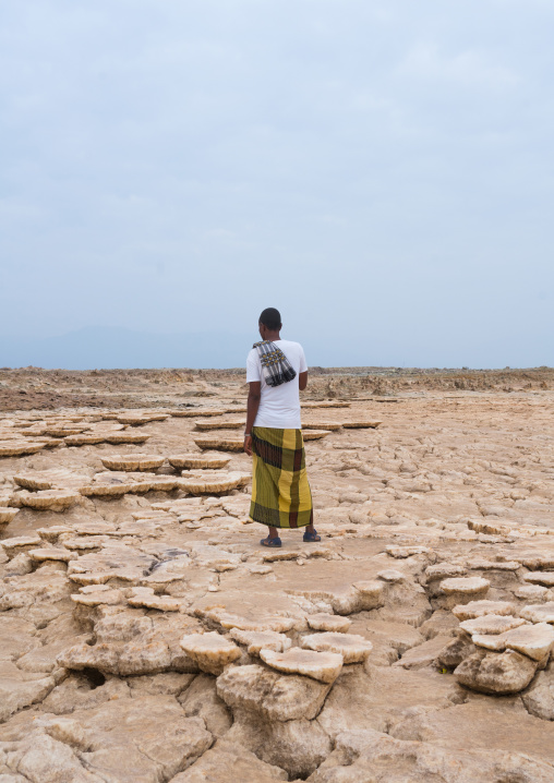 Afar man in the volcanic formations of the danakil depression, Afar region, Dallol, Ethiopia