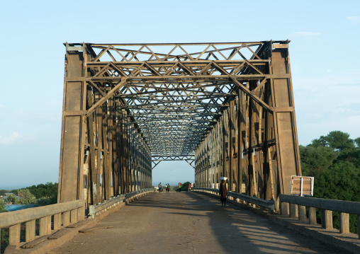 Metal bridge being built by chinese workers above omo river, Omo valley, Omorate, Ethiopia