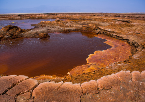 Ochre acid lake in the danakil depression, Afar region, Dallol, Ethiopia