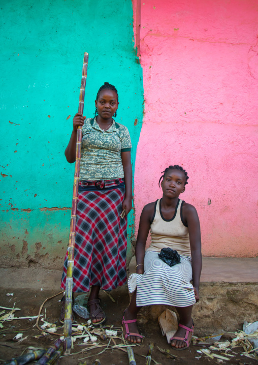 Two ethiopian women selling sugar canes in the market, Omo valley, Jinka, Ethiopia