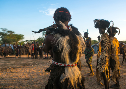 Dassanech men and women during dimi ceremony to celebrate circumcision of teenagers, Omo valley, Omorate, Ethiopia