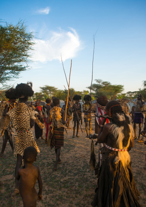 Dassanech men and women during dimi ceremony to celebrate circumcision of teenagers, Omo valley, Omorate, Ethiopia