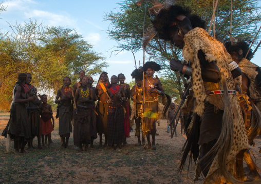 Dassanech men and women during dimi ceremony to celebrate circumcision of teenagers, Omo valley, Omorate, Ethiopia
