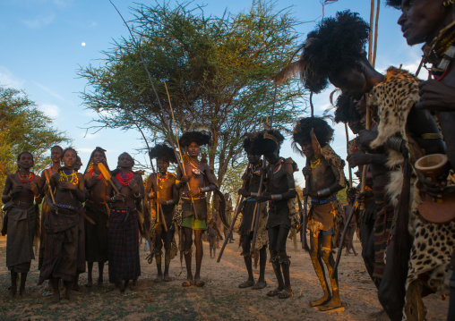 Dassanech men and women during dimi ceremony to celebrate circumcision of teenagers, Omo valley, Omorate, Ethiopia