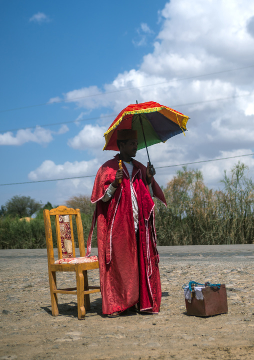 Monk collecting money a to build a new church, Gamo gofa omo, Arba minch, Ethiopia