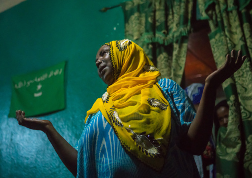 Sufi woman go into a trance during a ceremony, Harari region, Harar, Ethiopia