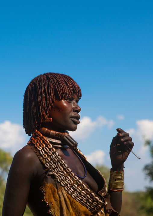 Hamer tribe woman attending a bull jumping ceremony, Omo valley, Turmi, Ethiopia