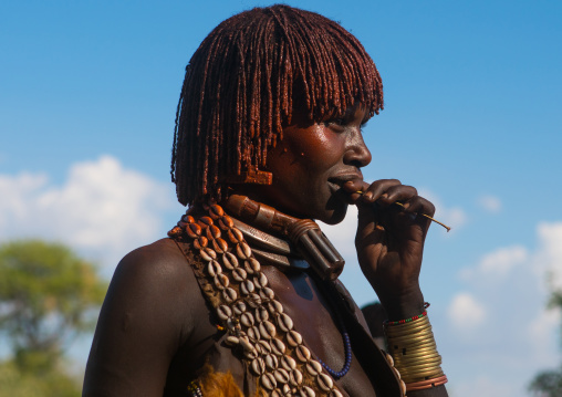 Hamer tribe woman attending a bull jumping ceremony, Omo valley, Turmi, Ethiopia