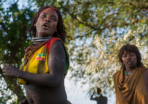 Hamer tribe women dancing during a bull jumping ceremony, Omo valley, Turmi, Ethiopia