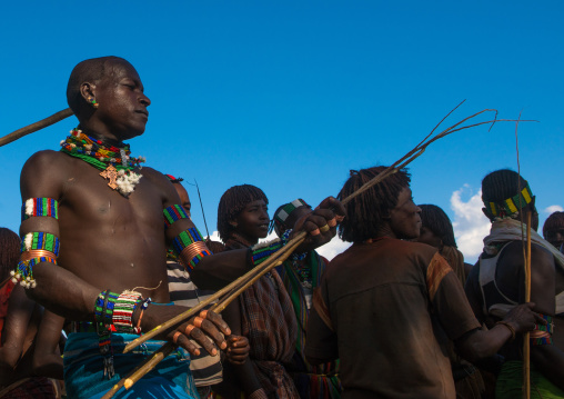 Hamer tribe maze whipping a woman during a bull jumping ceremony, Omo valley, Turmi, Ethiopia