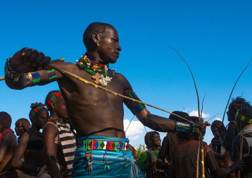 Hamer tribe maze whipping a woman during a bull jumping ceremony, Omo valley, Turmi, Ethiopia