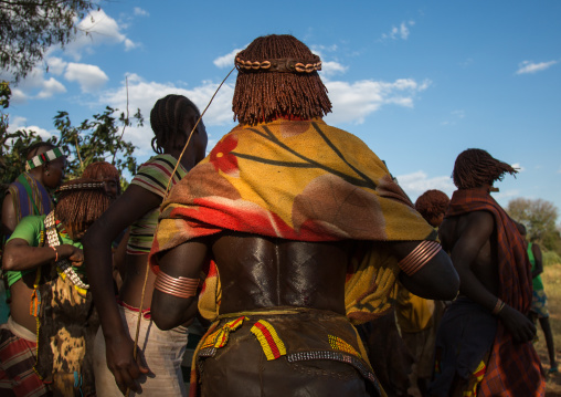 Hamer tribe women dancing during a bull jumping ceremony, Omo valley, Turmi, Ethiopia