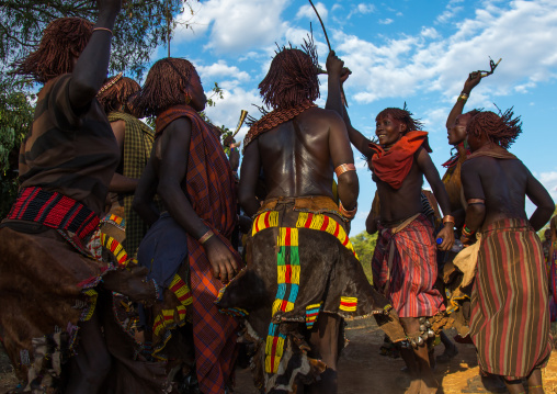 Hamer tribe women dancing during a bull jumping ceremony, Omo valley, Turmi, Ethiopia