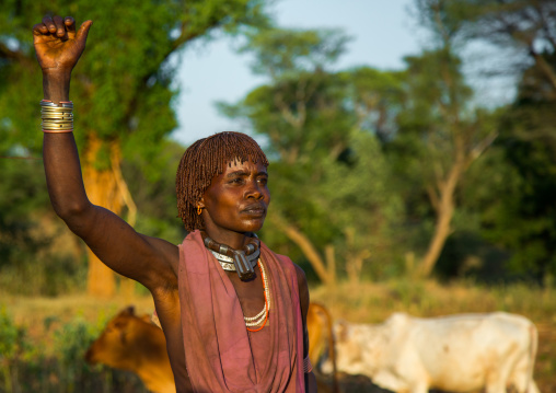 Hamer tribe woman waiting to be whipped during a bull jumping ceremony, Omo valley, Turmi, Ethiopia