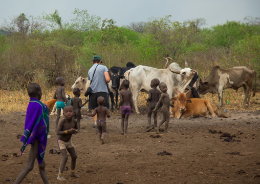 Western tourist visiting the bodi tribe, Omo valley, Hana mursi, Ethiopia