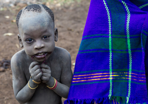 Bodi tribe boy covered with ashes, Omo valley, Hana mursi, Ethiopia