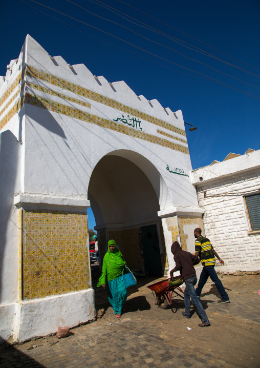 Ethiopian people passing thru showa gate which is stull used as jail by the police, Harari Region, Harar, Ethiopia