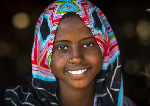 Portrait of a smiling Afar tribe girl, Afar region, Afambo, Ethiopia