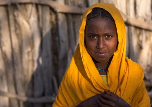 Portrait of an Afar tribe girl with a yellow veil, Afar region, Afambo, Ethiopia