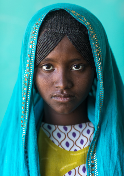Portrait of an Afar tribe girl with braided hair and a blue veil, Afar region, Semera, Ethiopia