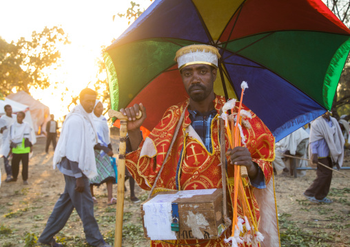 Ethiopian orthodox priest celebrating the colorful Timkat epiphany festival, Amhara region, Lalibela, Ethiopia