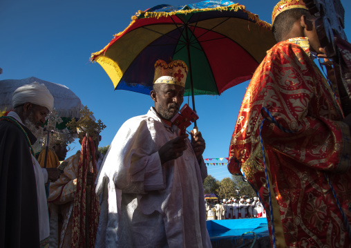Ethiopian orthodox priests procession celebrating the colorful Timkat epiphany festival, Amhara region, Lalibela, Ethiopia