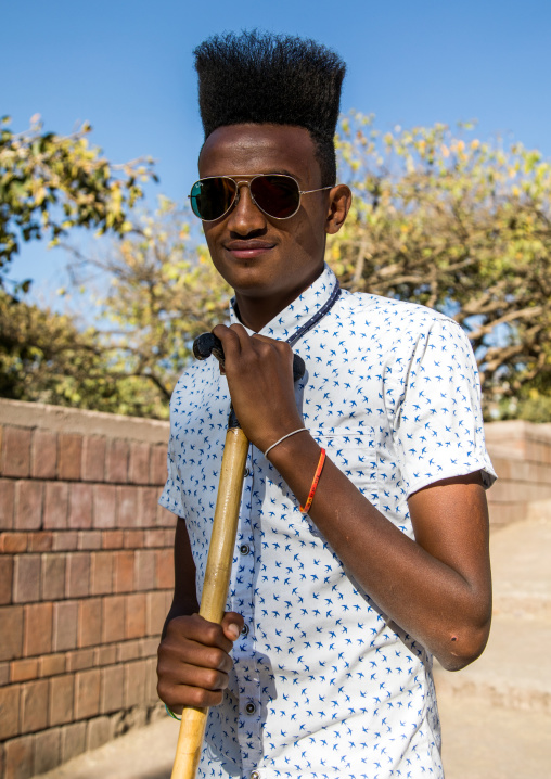 Ethiopian young man with incredible gelled hair, Amhara region, Lalibela, Ethiopia