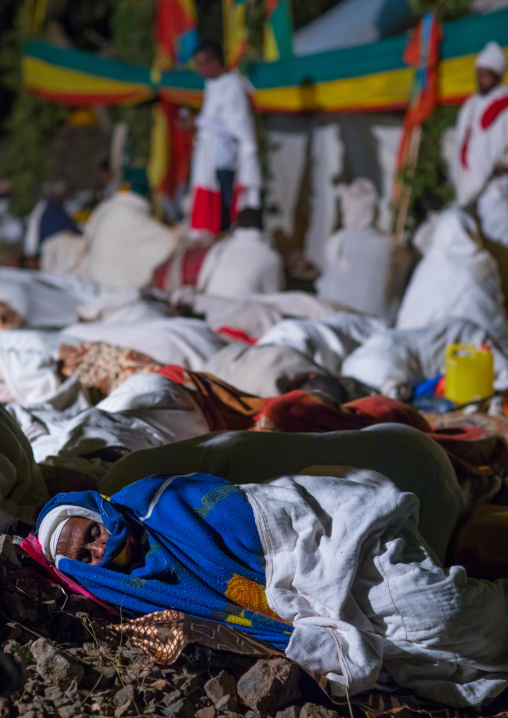 Orthodox pilgrims at Timkat festival during nightime, Amhara region, Lalibela, Ethiopia