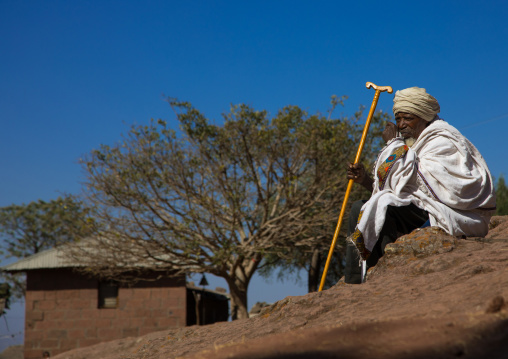 Priest of the ethiopian orthodox church in white shawl, Amhara region, Lalibela, Ethiopia