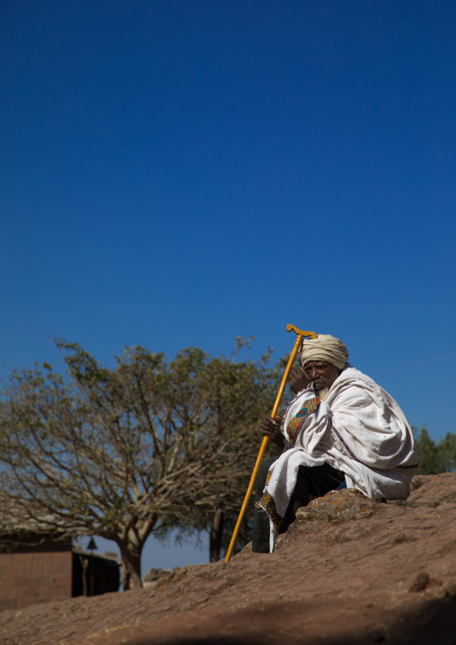 Priest of the ethiopian orthodox church in white shawl, Amhara region, Lalibela, Ethiopia