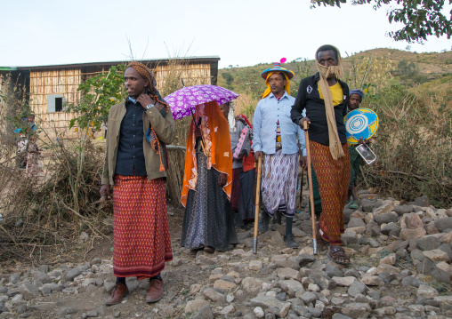 Oromo woman veiled during her wedding celebration with her husband and relatives, Amhara region, Artuma, Ethiopia