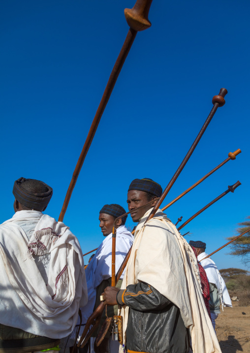 Borana tribe men with their ororo sticks during the Gada system ceremony, Oromia, Yabelo, Ethiopia
