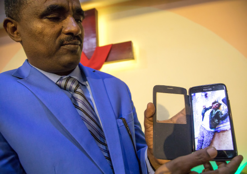 Pastor Kalab Atlabachew in gospel church showing a video of exorcism, Addis Ababa region, Addis Ababa, Ethiopia