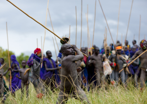 Suri tribe warriors fighting during a donga stick ritual, Omo valley, Tulgit, Ethiopia