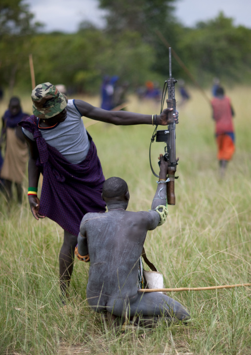 Suri tribe warriors fighting during a donga stick ritual, Omo valley, Tulgit, Ethiopia