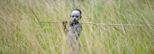 Suri Boy Imitating The Adult Warriors, Omo Valley, Ethiopia
