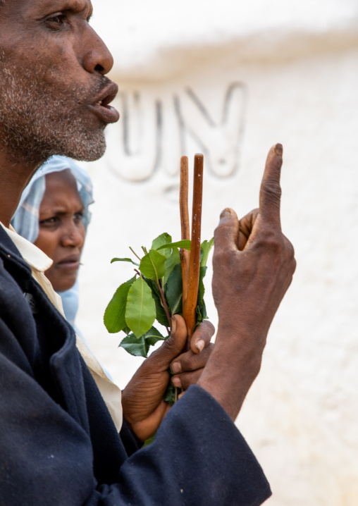 Oromo man with a forked stick in Sheikh Hussein shrine, Oromia, Sheik Hussein, Ethiopia