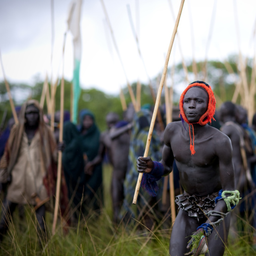 Suri tribe warriors fighting during a donga stick ritual, Omo valley, Tulgit, Ethiopia